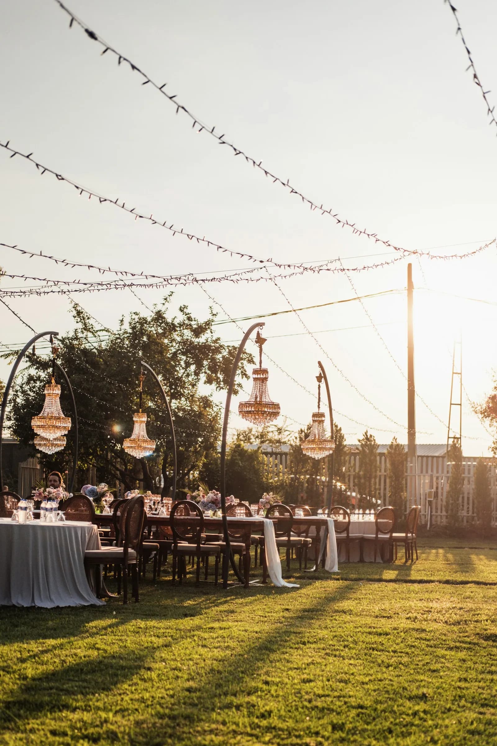 Guests seated at tables outdoors at a wedding reception