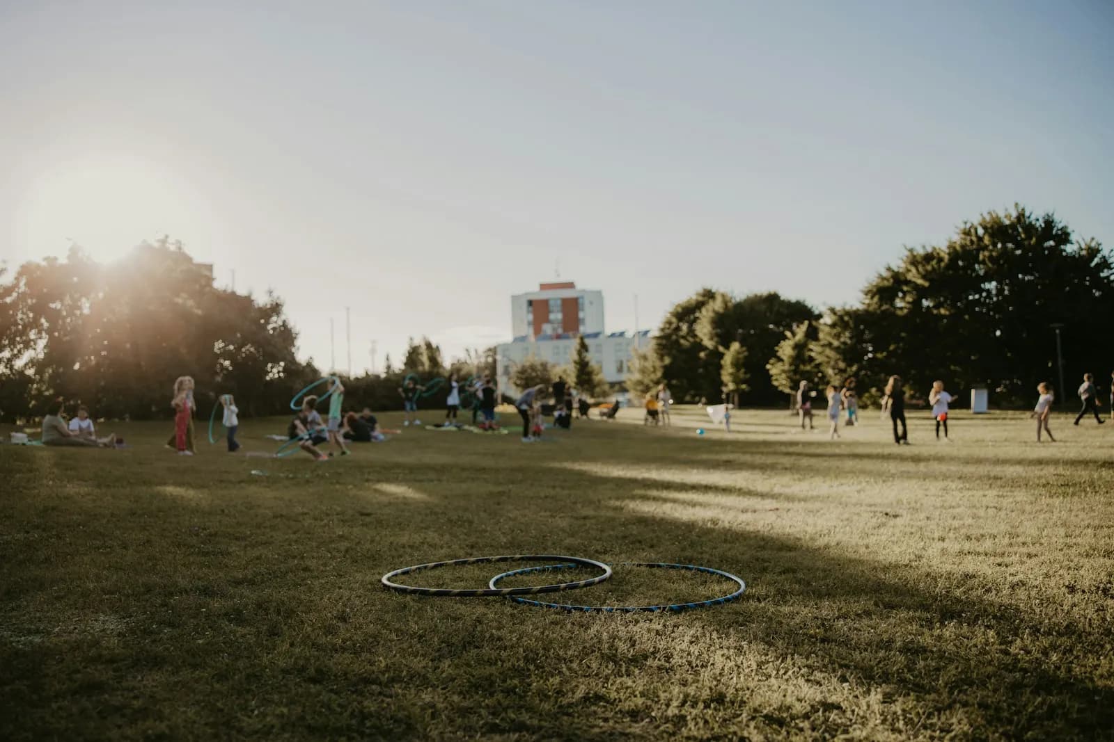 Hula hoops lying on a lawn at a park gathering